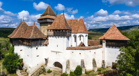 Viscri fortified Chruch in the middle of Transylvania, Romania. Aerial view from drone. Important tourist attraction.